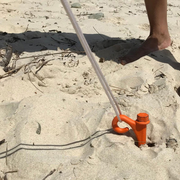 A GroundGrabba Lite in use on a sandy beach. 